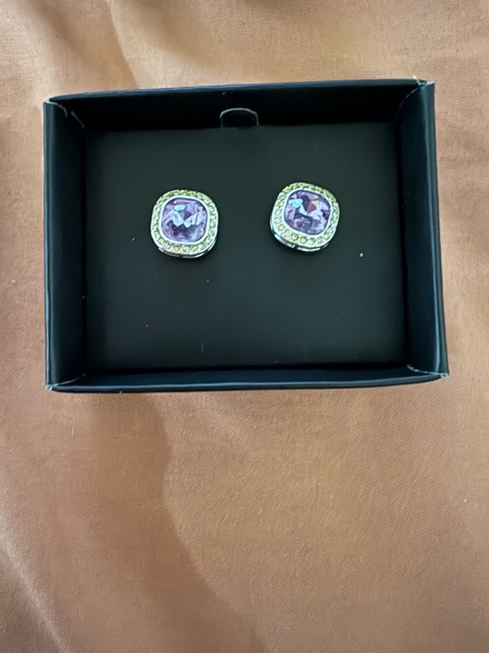 Brand new and never used Avon Gold-Tone Stud Earrings with Purple Centers